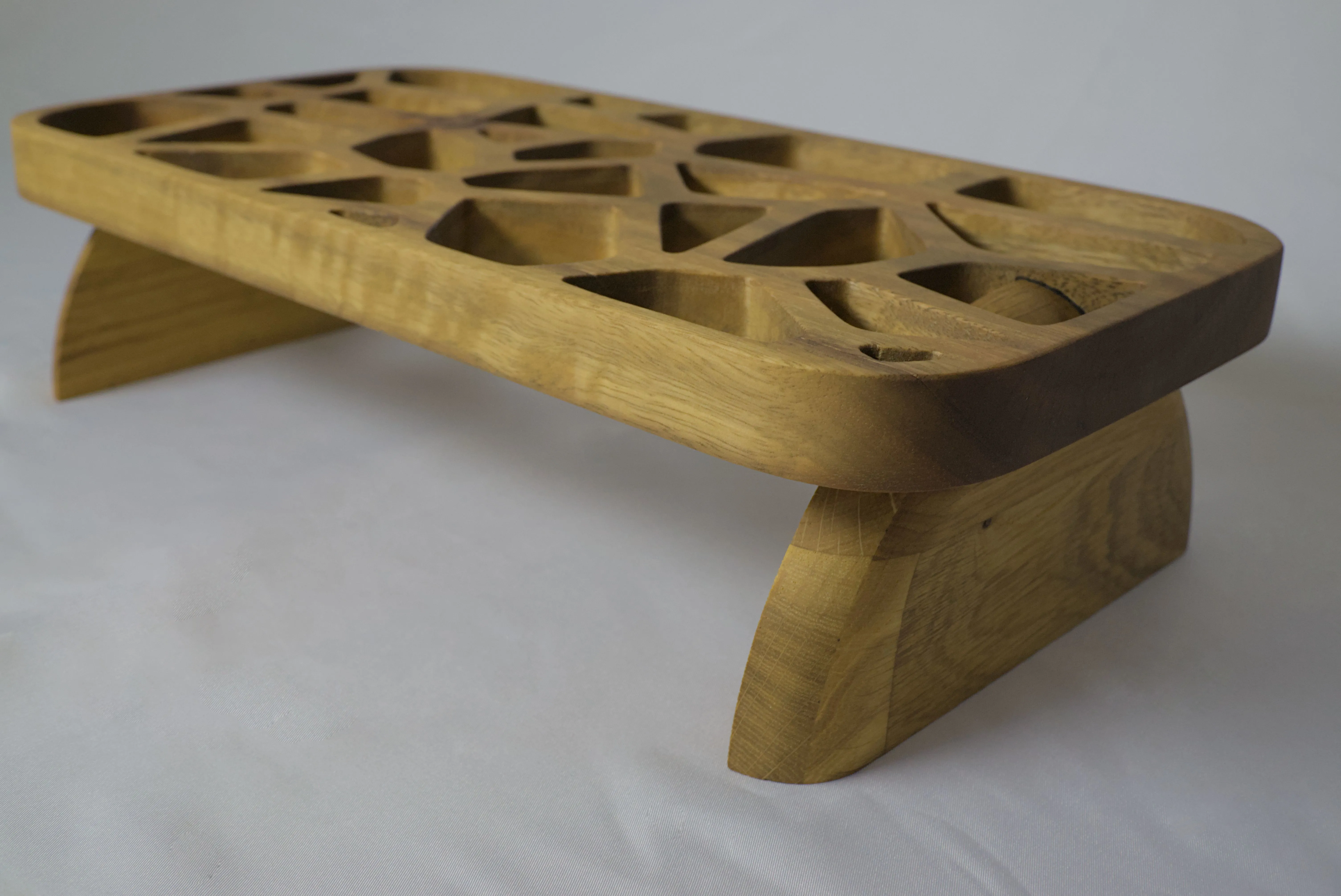 Angled view of a timber stand with a voronoi pattern cut into it