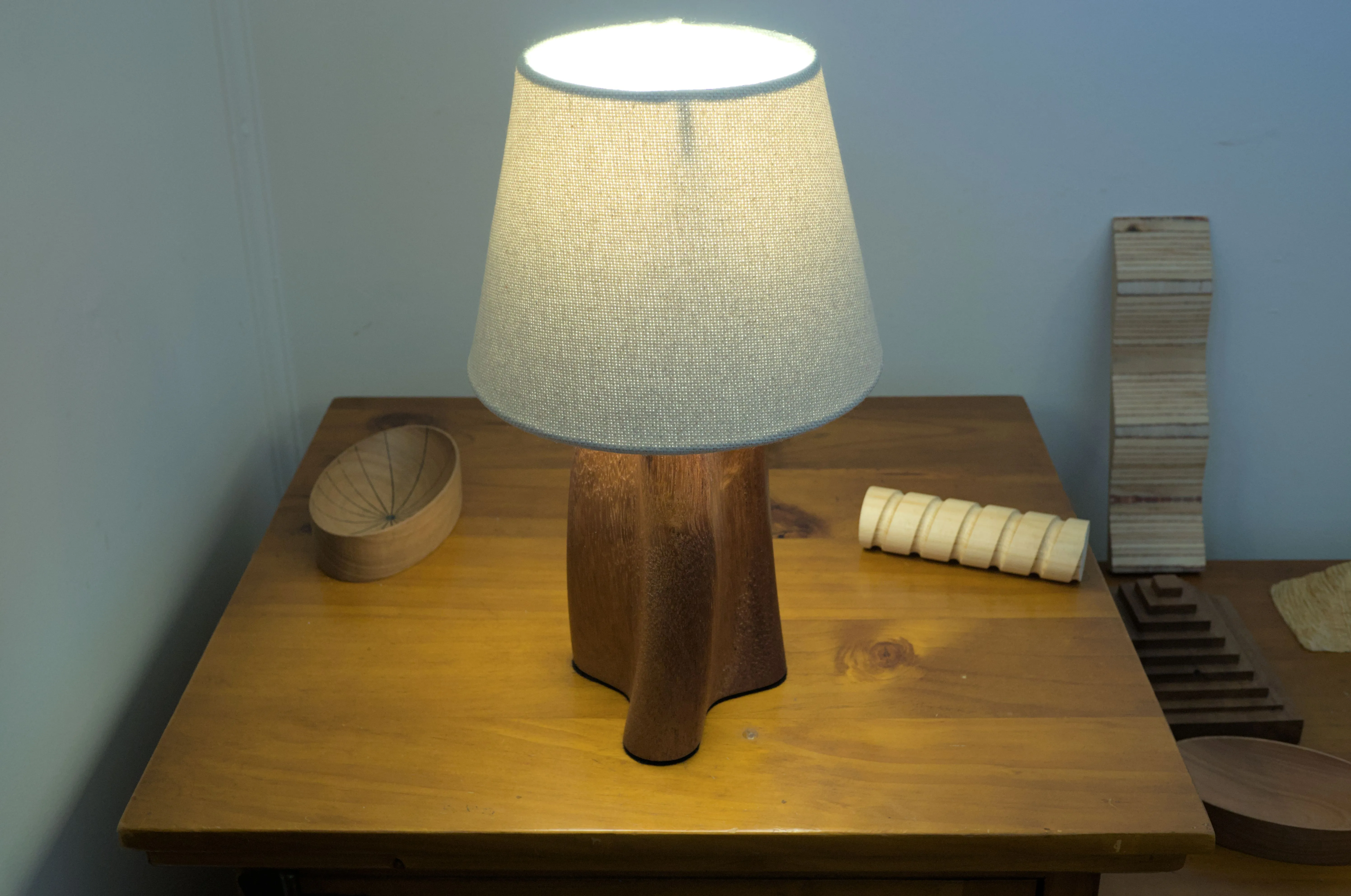 Overhead view of a table lamp with a curving and twisting shape